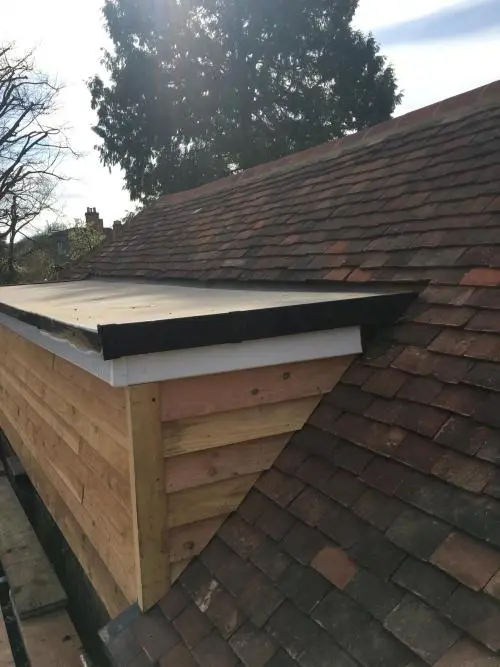 New dormer including cedar cladding and Firestone EPDM flat rubber roof
