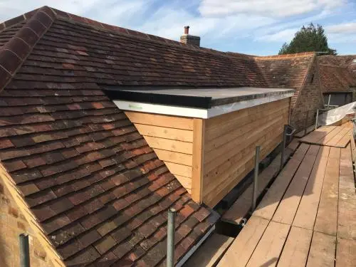 New dormer including cedar cladding and Firestone EPDM flat rubber roof