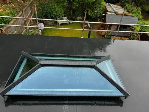 New Firestone EPDM flat rubber roof with new glass lantern